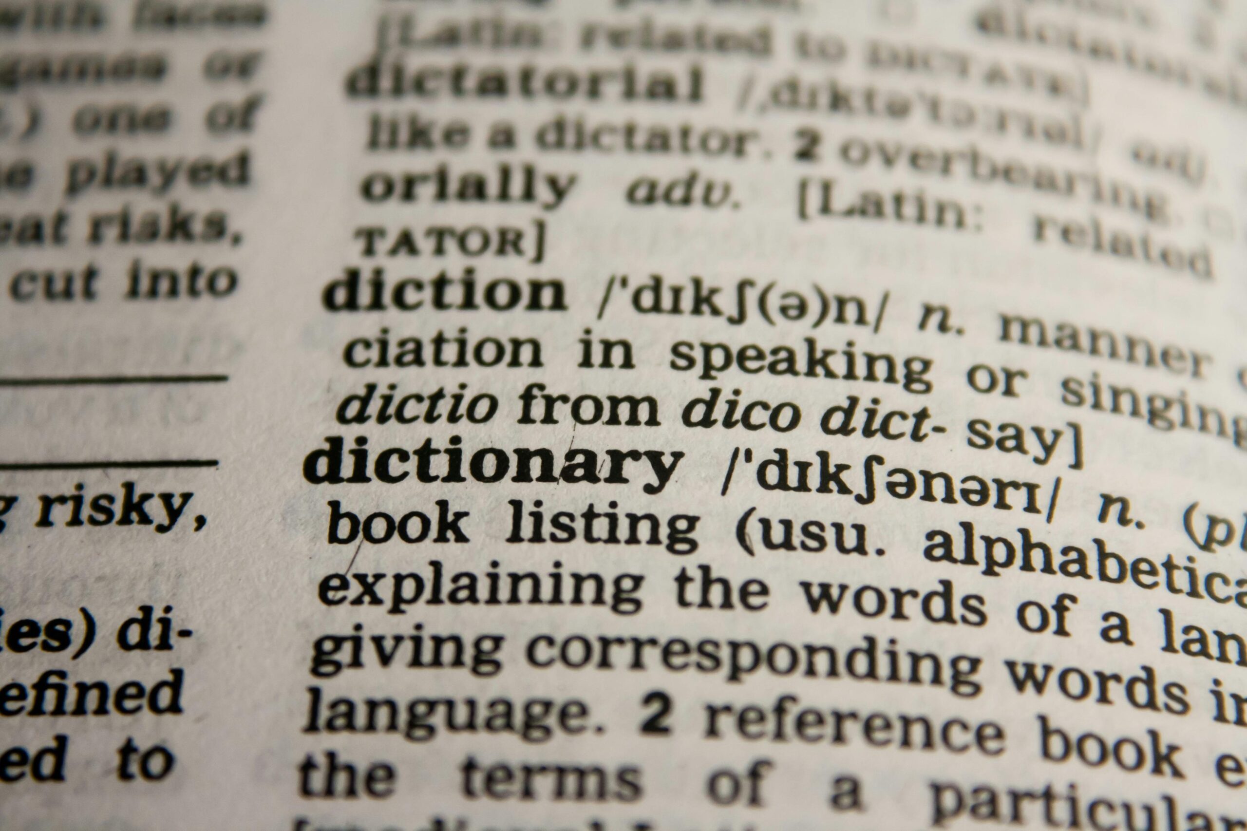 Academics Detailed close-up view of a dictionary page highlighting the word 'dictionary' and its definition.