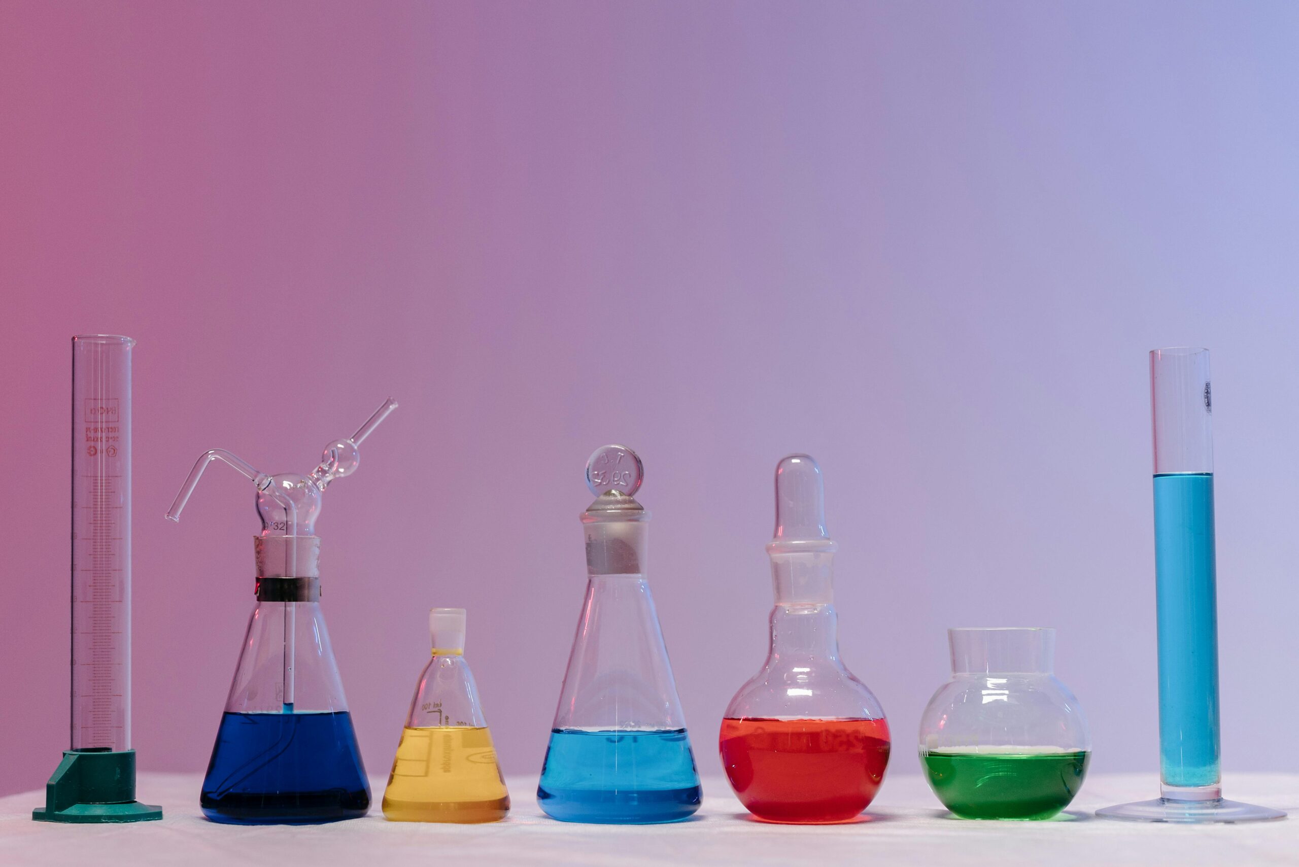 Academics Vibrant glassware filled with colorful liquids in a laboratory setting.